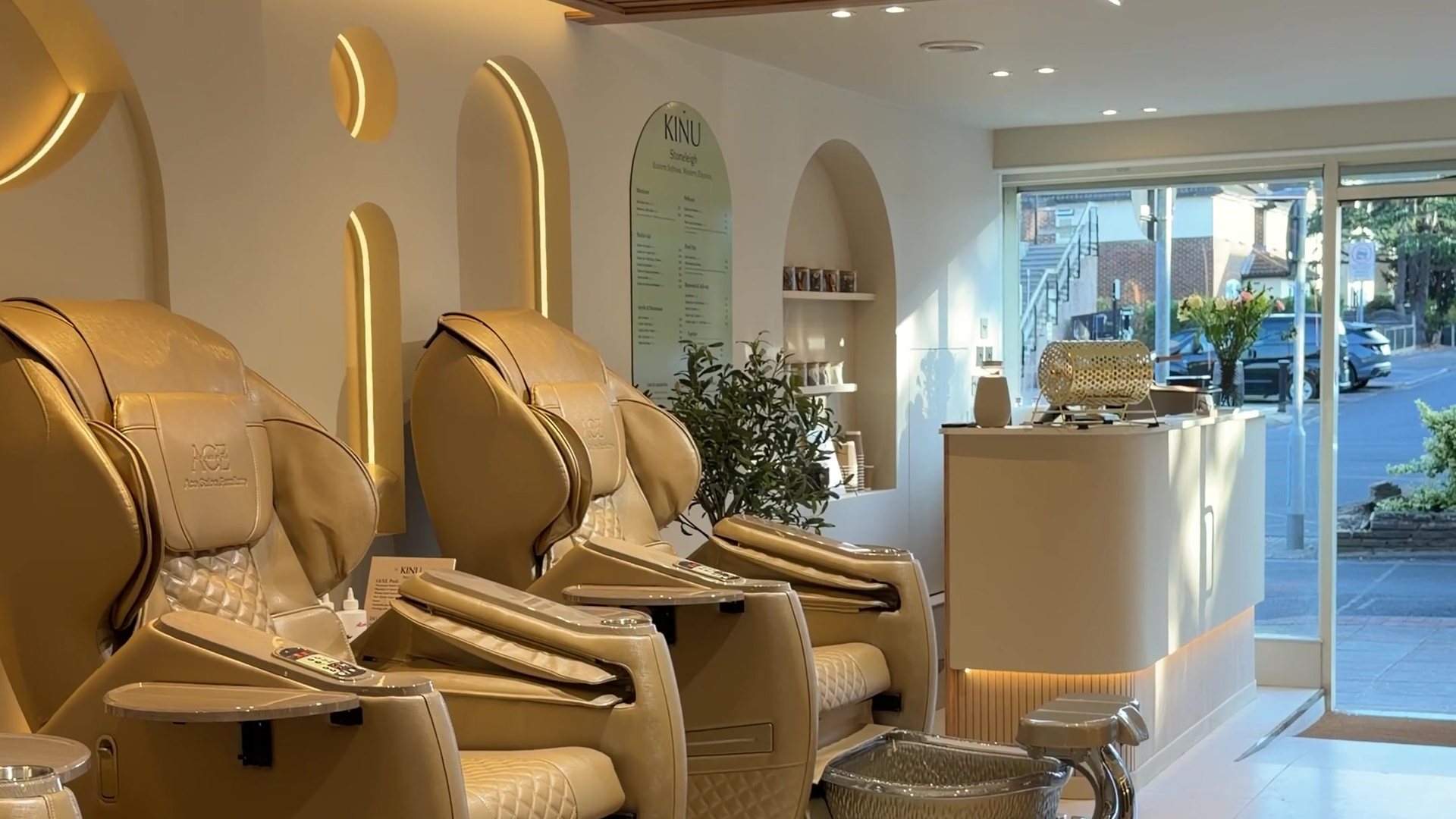 Spa pedicure chairs at KINU Stoneleigh, looking towards reception and the window onto Stoneleigh Broadway